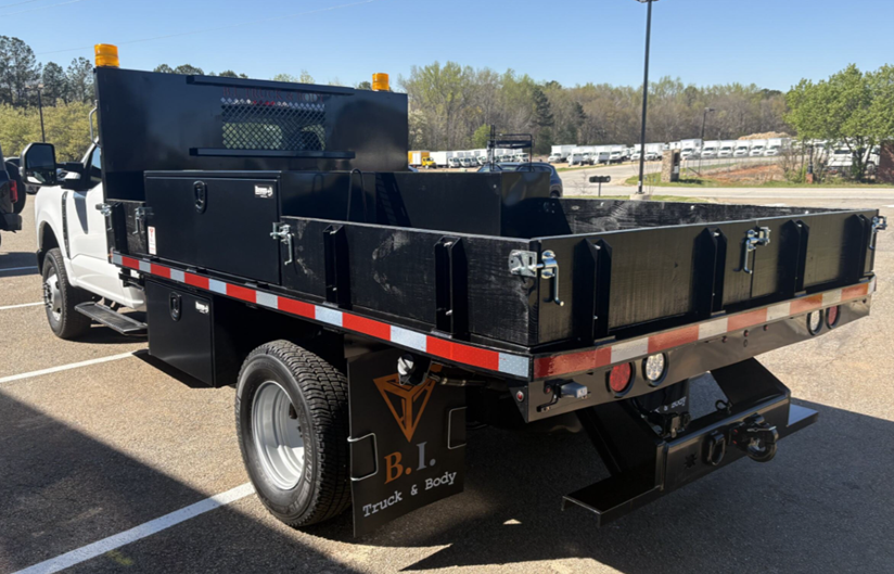 Custom flatbed truck with rear corner view built for rugged jobsite work